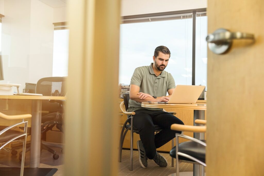 man sitting inside office